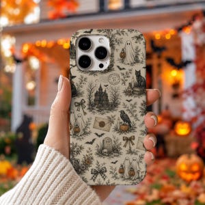 May include: A beige smartphone case featuring a detailed black ink-style pattern of Halloween motifs including ghosts holding pumpkins, a haunted house, a black cat, a raven, a tombstone, skulls, envelopes, and bows, with a circular postmark stamp.