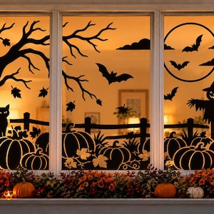 May include: A set of black window decals featuring silhouettes of a bare tree, a cat, pumpkins, a fence, bats, a full moon, and a scarecrow. The designs are applied to a three-pane window, creating a dark, seasonal scene against the warm indoor light.