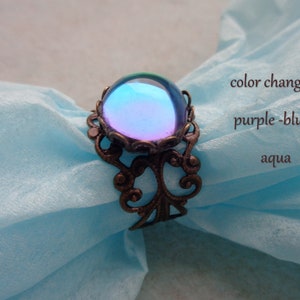 Filigree bronze ring, size adjustable, with shimmering cabochon aqua, blue purple