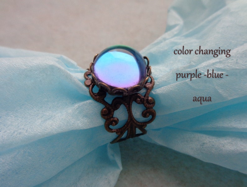 Filigree bronze ring, size adjustable, with shimmering cabochon aqua, blue purple