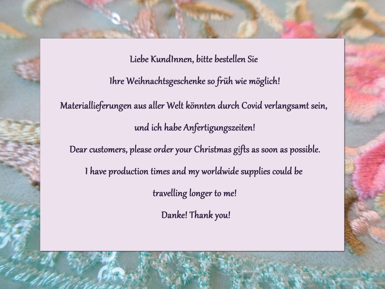 May include: A light purple card with a message in both English and German. The message encourages customers to order their Christmas gifts as soon as possible due to potential delays in shipping and production.