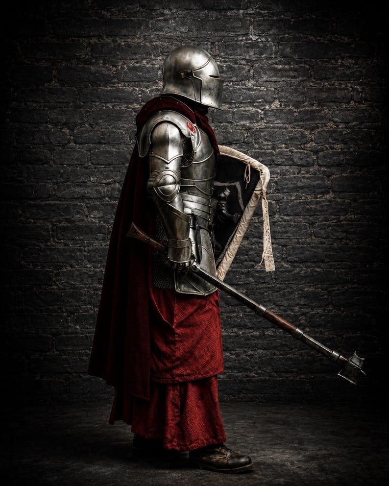 May include: A suit of polished steel plate armor featuring a rounded helmet, shoulder pauldrons, and gauntlets. The armor is worn over a deep red hooded cloak and matching red tunic. A metal mace with a wooden handle and a shield are held in hand.