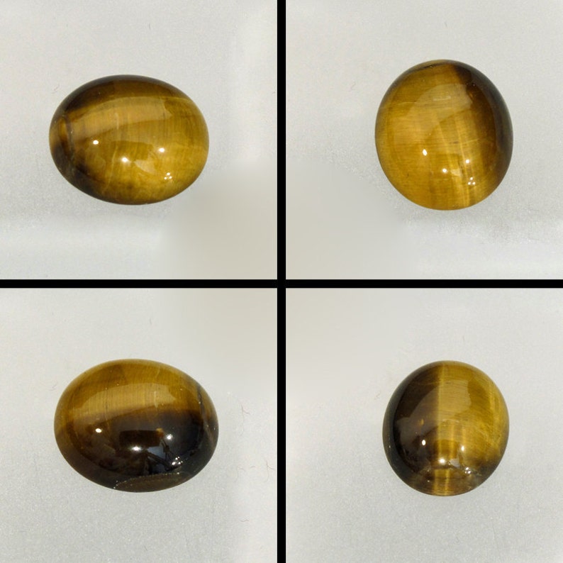 May include: Four oval-shaped tiger's eye gemstones, each with a different pattern of brown and gold stripes. The stones are smooth and polished, with a glossy finish.
