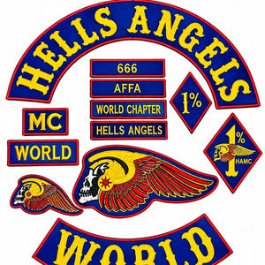 May include: A collection of embroidered patches featuring blue backgrounds with yellow text and red borders. The set includes a large arched Hells Angels patch, a Nomads rocker, a World rocker, two diamond-shaped 1% patches, and various rectangular text patches including 666, AFFA, and World Chapter, alongside two winged skull emblems.