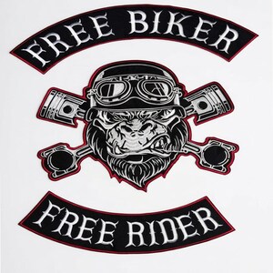 May include: A three-piece embroidered patch set featuring a central gorilla wearing a helmet and goggles, flanked by two crossed engine pistons. The top arch reads FREE BIKER and the bottom arch reads FREE RIDER in white text on black.