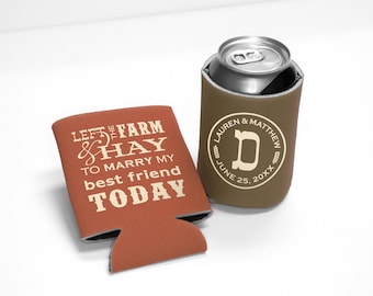 May include: Two foam can coolers. One is rust-colored with white text reading LEFT THE FARM & HAY TO MARRY MY best friend TODAY. The other is brown, holding a silver aluminum can, featuring a circular white logo with LAUREN & MATTHEW, JUNE 25, 20XX.