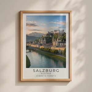 May include: A framed vertical wall art print featuring a scenic landscape of Salzburg, Austria, with a river in the foreground, historic buildings, and a hilltop fortress. The text reads SALZBURG AUSTRIA 47.8095 N, 13.0550 E at the bottom.