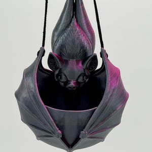 Pink and Black Silk.  Check out the video for a really good glimpse of just how beautiful this color is.  Low stock, and additional time may be needed. Please keep in mind every bat will have a different variation of the pink and black.