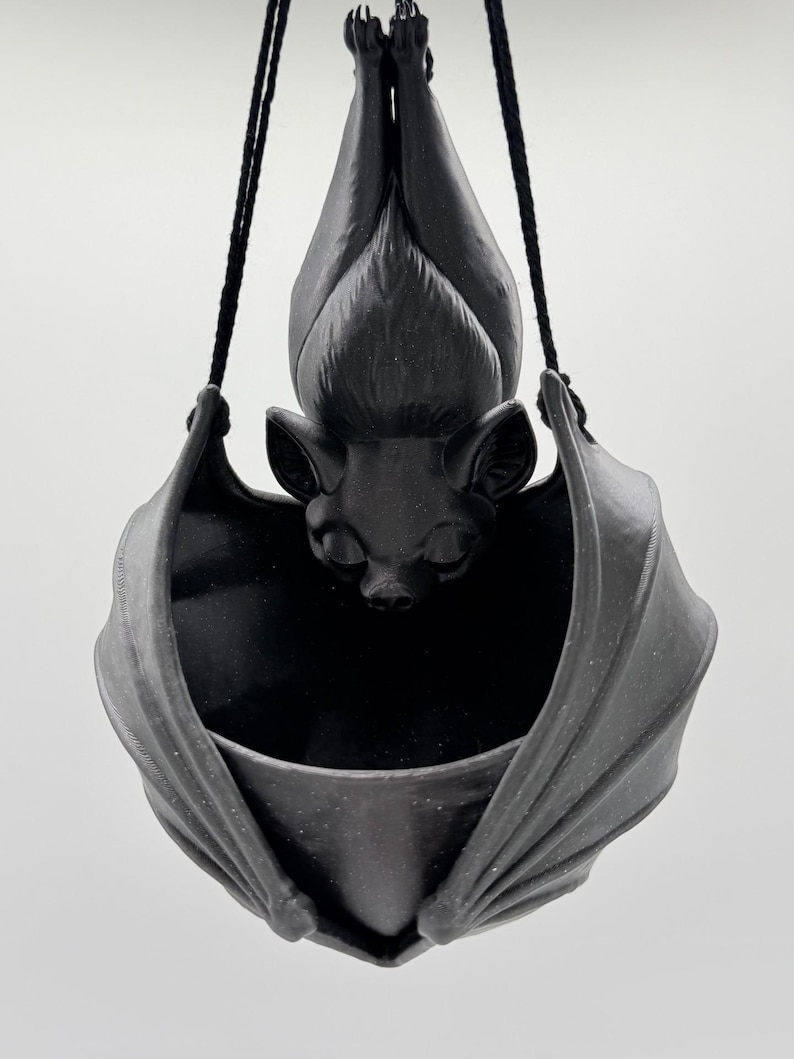 Shimmering Black w/ Black String.  Glistens when light hits it.