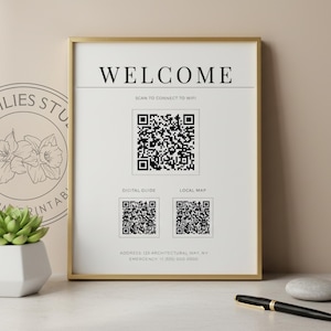 May include: A vertical rectangular sign in a gold frame featuring the word WELCOME at the top, three black and white QR codes, and text including SCAN TO CONNECT TO WIFI, DIGITAL GUIDE, LOCAL MAP, ADDRESS 123 ARCHITECTURAL WAY, NY, and EMERGENCY +1 (555) 000 0000.