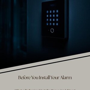 May include: A black digital alarm keypad with a numeric interface and a circular sensor mounted on a dark wall. The text EBOOK, Before You Install Your Alarm, and What a Professional Installer Knows (and Almost No One Tells You) is displayed.