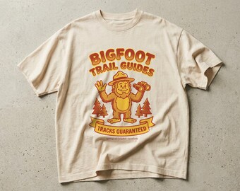 Bigfoot Trail Guides Tee, Funny Sasquatch Cryptid Shirt, Retro Camping Hiking Humor Graphic Tee