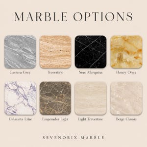 May include: A display titled MARBLE OPTIONS featuring eight square stone samples labeled Carrara Grey, Travertine, Nero Marquina, Honey Onyx, Calacatta Lilac, Emperador Light, Light Travertine, and Beige Classic, with the text SEVENORIX MARBLE below.