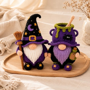 May include: Two crocheted gnomes, one wearing a black pointed hat with yellow stars and a purple crescent moon, holding a brown broom. The second gnome is shaped like a purple cauldron with green drips, a black spider, and a small glass bottle.