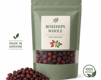 May include: A sage green stand-up pouch containing whole dried rosehips, featuring a clear window at the bottom. The label reads ROSEHIPS WHOLE, 100% NATURAL, and MADE IN UKRAINE, with a small illustration of rosehips and a separate 100% NATURAL seal.