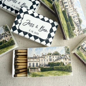 May include: Several rectangular matchboxes featuring a black and white diamond pattern with the text Jess & Ben 5.16.2026, alongside matchboxes displaying a watercolor illustration of a large estate with a green lawn and manicured hedges.