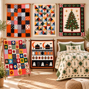 May include: Five decorative quilts and a bedspread are displayed. Three quilts hang on the wall featuring Halloween patterns, geometric triangles, and a Christmas tree. Two quilts stand on racks showing floral squares and Halloween motifs.