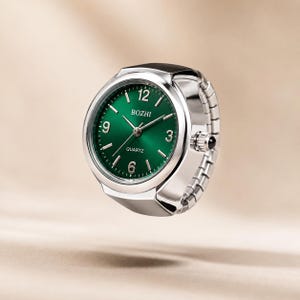 May include: A silver-toned ring watch featuring a round face with a deep green dial, silver hands, and silver hour markers. The dial displays the text BOZHI and QUARTZ. The band is constructed from flexible, expandable silver-toned metal links.