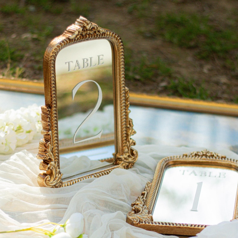 Our Mirror Wedding Table Numbers bring timeless elegance to any celebration, serving as both functional Wedding Table Numbers and eye-catching Wedding Table Decor. Paired with warm Gold Reception Decor accents and a coordinating Wed Sign, these Mirrored Table Numbers Unique pieces create a polished, romantic atmosphere guests will remember.