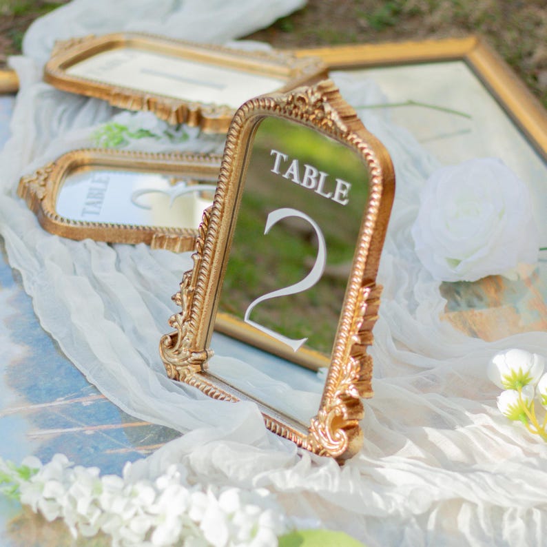 Our Mirror Wedding Table Numbers bring timeless elegance to any celebration, serving as both functional Wedding Table Numbers and eye-catching Wedding Table Decor. Paired with warm Gold Reception Decor accents and a coordinating Wed Sign, these Mirrored Table Numbers Unique pieces create a polished, romantic atmosphere guests will remember.