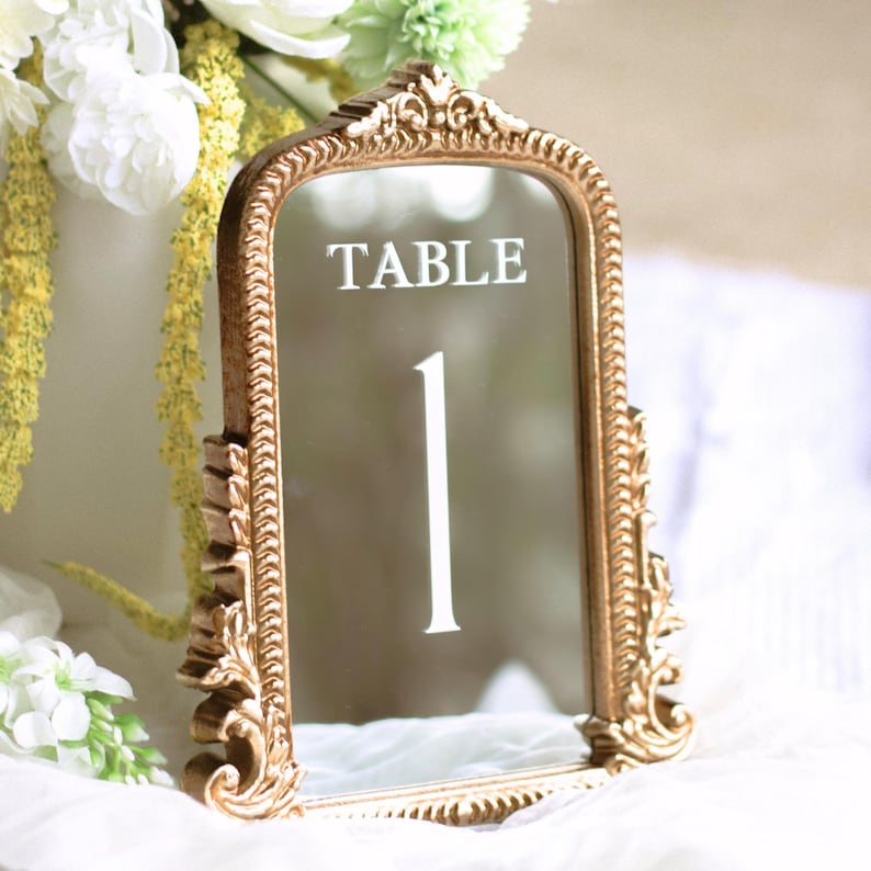 Our Mirror Wedding Table Numbers bring timeless elegance to any celebration, serving as both functional Wedding Table Numbers and eye-catching Wedding Table Decor. Paired with warm Gold Reception Decor accents and a coordinating Wed Sign, these Mirrored Table Numbers Unique pieces create a polished, romantic atmosphere guests will remember.