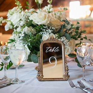 Our Mirror Wedding Table Numbers bring timeless elegance to any celebration, serving as both functional Wedding Table Numbers and eye-catching Wedding Table Decor. Paired with warm Gold Reception Decor accents and a coordinating Wed Sign, these Mirrored Table Numbers Unique pieces create a polished, romantic atmosphere guests will remember.