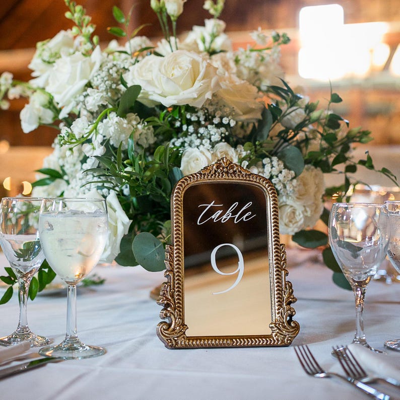 Our Mirror Wedding Table Numbers bring timeless elegance to any celebration, serving as both functional Wedding Table Numbers and eye-catching Wedding Table Decor. Paired with warm Gold Reception Decor accents and a coordinating Wed Sign, these Mirrored Table Numbers Unique pieces create a polished, romantic atmosphere guests will remember.
