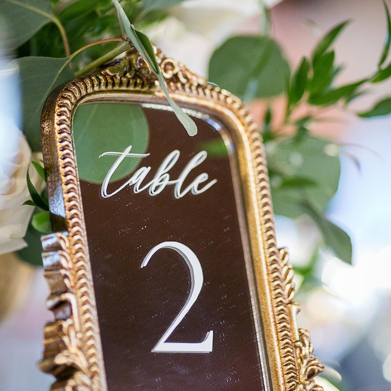 Our Mirror Wedding Table Numbers bring timeless elegance to any celebration, serving as both functional Wedding Table Numbers and eye-catching Wedding Table Decor. Paired with warm Gold Reception Decor accents and a coordinating Wed Sign, these Mirrored Table Numbers Unique pieces create a polished, romantic atmosphere guests will remember.