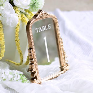 Our Mirror Wedding Table Numbers bring timeless elegance to any celebration, serving as both functional Wedding Table Numbers and eye-catching Wedding Table Decor. Paired with warm Gold Reception Decor accents and a coordinating Wed Sign, these Mirrored Table Numbers Unique pieces create a polished, romantic atmosphere guests will remember.