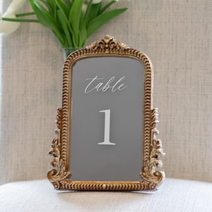 Our Mirror Wedding Table Numbers bring timeless elegance to any celebration, serving as both functional Wedding Table Numbers and eye-catching Wedding Table Decor. Paired with warm Gold Reception Decor accents and a coordinating Wed Sign, these Mirrored Table Numbers Unique pieces create a polished, romantic atmosphere guests will remember.