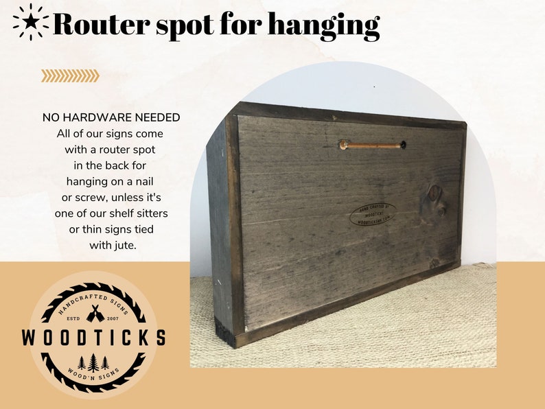 May include: The back of a wooden sign with a router spot for hanging. The sign is brown and has a white label with the text "HANDCRAFTED SIGNS ESTD 2007 WOODTICKS WOOD'N SIGNS".