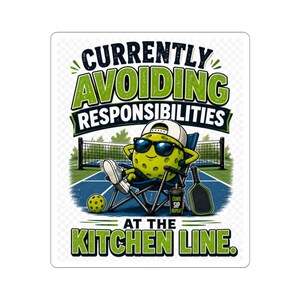 May include: A rectangular sticker featuring a yellow pickleball character wearing sunglasses and a white cap, sitting in a folding chair on a court. The text reads CURRENTLY AVOIDING RESPONSIBILITIES AT THE KITCHEN LINE with a pickleball and paddle.