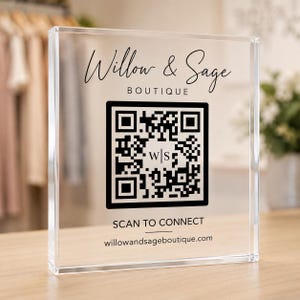 May include: A clear acrylic square sign featuring black printed text and a QR code. The text reads Willow & Sage BOUTIQUE, SCAN TO CONNECT, and willowandsageboutique.com. A small W|S monogram is centered within the black and white QR code graphic.