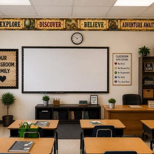May include: A classroom interior featuring a large central whiteboard, wooden student desks, and a teacher's desk. Walls are decorated with posters reading Our Classroom Family, Classroom Expectations, and You Matter, with a border saying Explore Discover Believe Adventure Awaits.