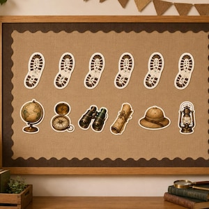May include: A rectangular bulletin board with a tan fabric center and dark brown scalloped border. It features twelve cut-out stickers: six brown boot prints in a row, followed by a globe, compass, binoculars, scroll, hat, and lantern.
