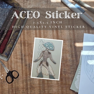 May include: A rectangular vinyl sticker measuring 2.5 x 3.5 inches featuring a stylized figure with a teal mushroom cap head, a grey torso, and white lace-like detailing on the lower body, set against a light green background with a vertical pattern.