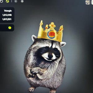May include: A gray and black raccoon wearing a gold crown with the Burger King logo on the front. The raccoon is standing upright with its front paws held together near its chest, featuring a dark mask around its eyes and a thick fur coat.