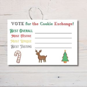 May include: A white card with the text "VOTE for the Cookie Exchange!" in various colors. The card features illustrations of a candy cane, a reindeer, and a Christmas tree. Lines are provided for voting categories: Best Overall, Most Festive, Most Unique, and Best Tasting.