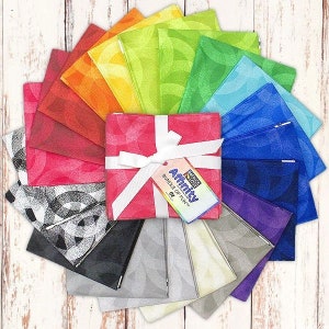 May include: A bundle of 21 fabric squares in a rainbow of colors with a white ribbon and a tag that reads "Paper Pieces Affinity Bundle of Fun™".