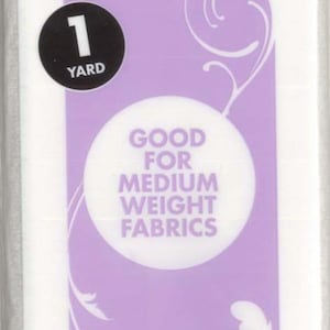 May include: A purple and white package of Heat n Bond fusible interfacing for sewing. The package is labeled "Sewable" and "Good for Medium Weight Fabrics". It is 20 inches by 1 yard (50.8 cm x 0.91 m) and made in the USA.