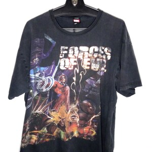 May include: A black short-sleeve t-shirt featuring a graphic print of Marvel characters including Magneto and Galactus. The text "FORCES OF EVIL" is printed in large white letters across the upper chest area. The shirt has a crew neckline.
