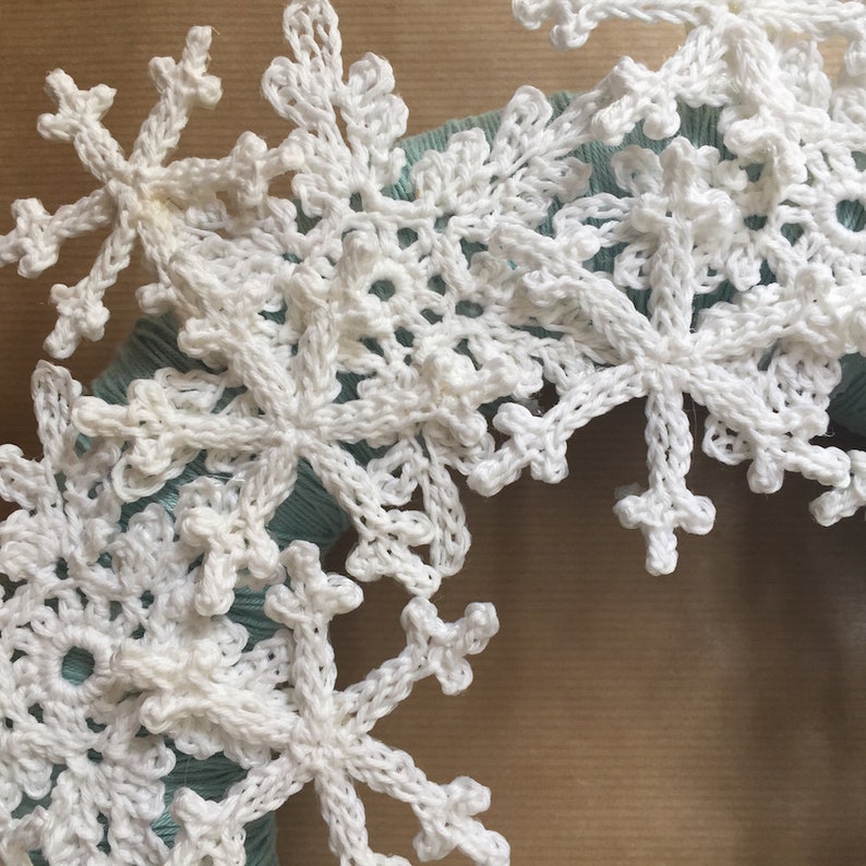 Closeup of crocheted snowflakes from a christmas wreath.