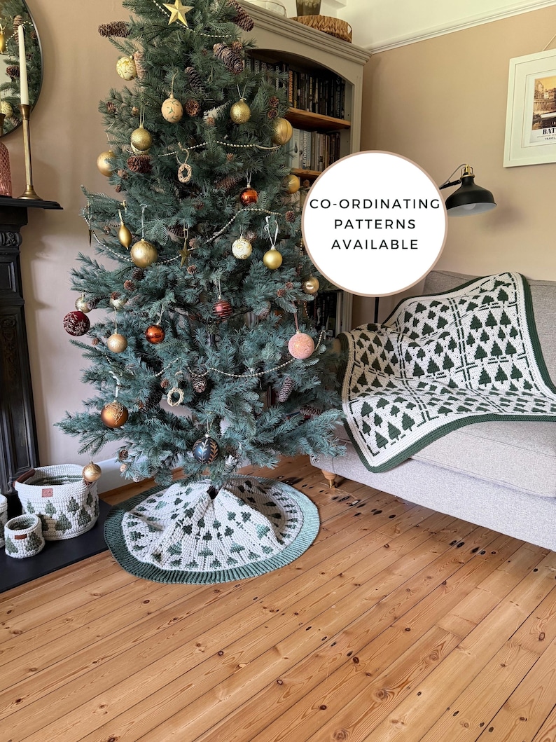 May include: A crochet Christmas tree skirt and matching throw blanket featuring a repeating dark green pine tree pattern on a cream background. The items have a dark green ribbed border. A circular sign reads CO-ORDINATING PATTERNS AVAILABLE.
