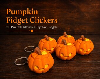 May include: Four orange pumpkin-shaped fidget clickers with brown stems and yellow accents, each attached to a silver metal keychain ring. The text Pumpkin Fidget Clickers 3D Printed Halloween Keychain Fidgets is displayed above the objects.