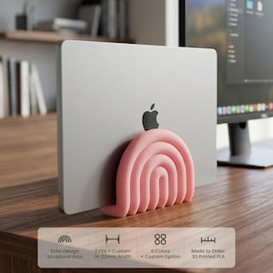 May include: A light pink, arch-shaped laptop stand holding a silver laptop. The stand features a series of concentric, raised, rounded arcs. Text on the image indicates: Echo Design Sculptural Arcs, 3 Fits + Custom 14-22mm Width, 6 Colors, 3D Printed PLA.
