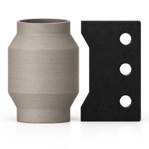 May include: A cylindrical, light gray vessel with a matte, textured finish and a tapered midsection, positioned next to a rectangular, black component featuring a notched side edge and three evenly spaced circular cutouts along its length.