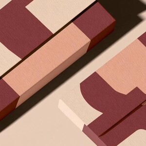 Contemporary matchbox mockup with a coloured paper sleeve and a clean graphic layout. The rectangular box is presented in soft directional light as a personalised wedding or event favour concept.