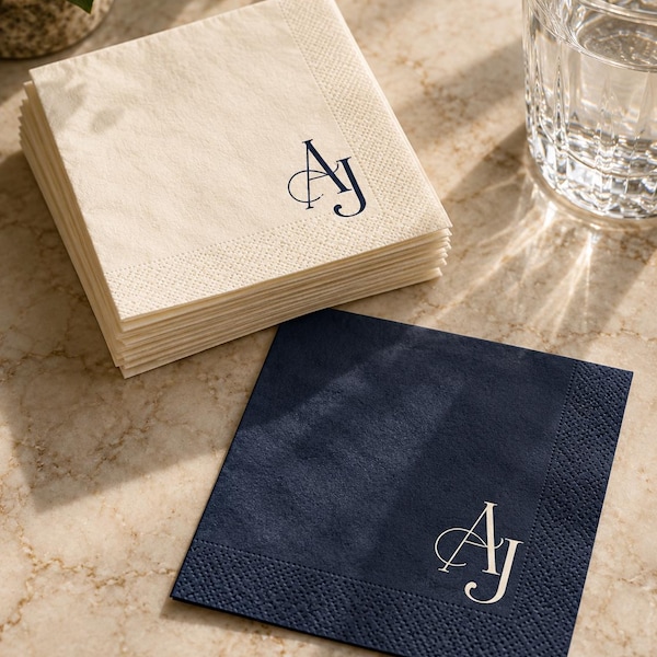 Cream and navy cocktail napkins with an AJ monogram