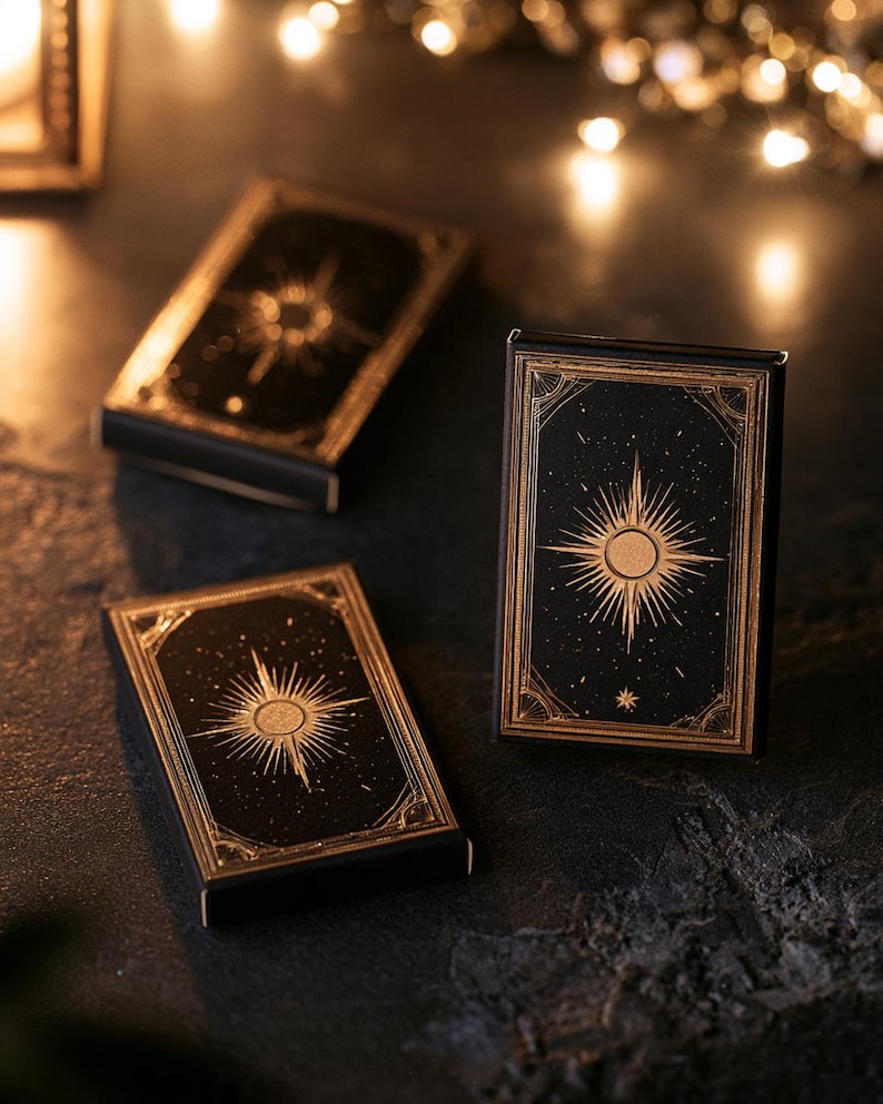 Dark matchbox mockups styled for an evening celebration, with plain and gold-toned decorative sleeve designs. The presentation shows compact rectangular boxes for personalised party favours.