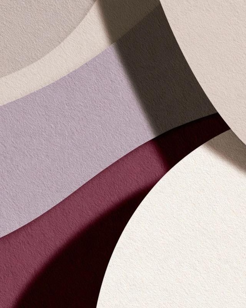 Layered unprinted menu-card mockups with curved paper edges in cream and muted burgundy tones. The arrangement shows contrasting paper shapes and soft shadows for a modern table-stationery design.